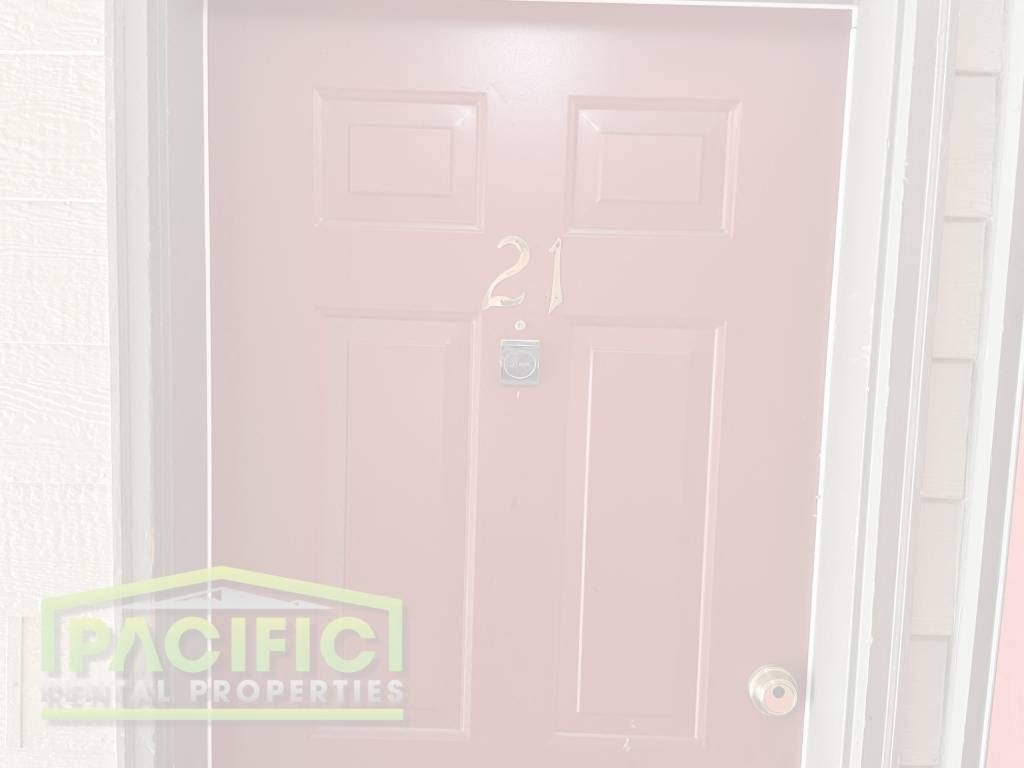 a pink door with a tag on it and a white door