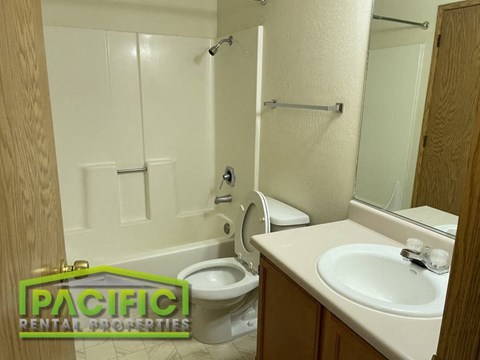 a bathroom with a toilet and a sink