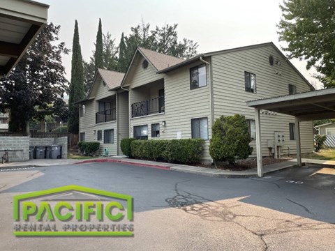 a house with a driveway and a parking lot