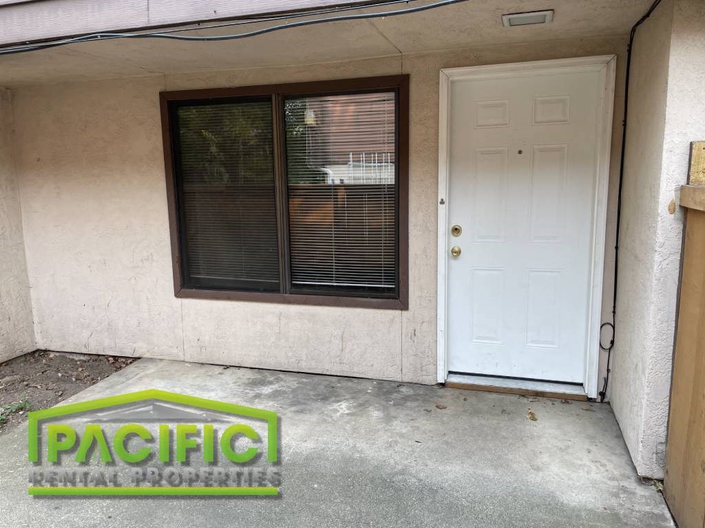 the front door of a house with a white door