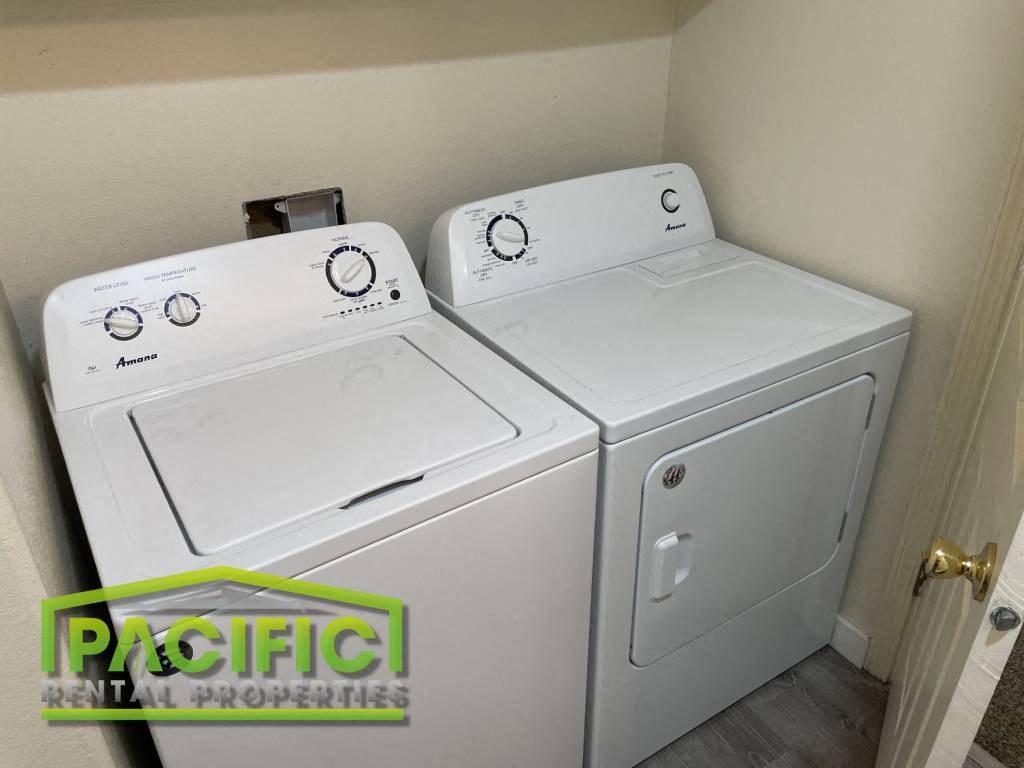 a washer and dryer are available in the laundry room