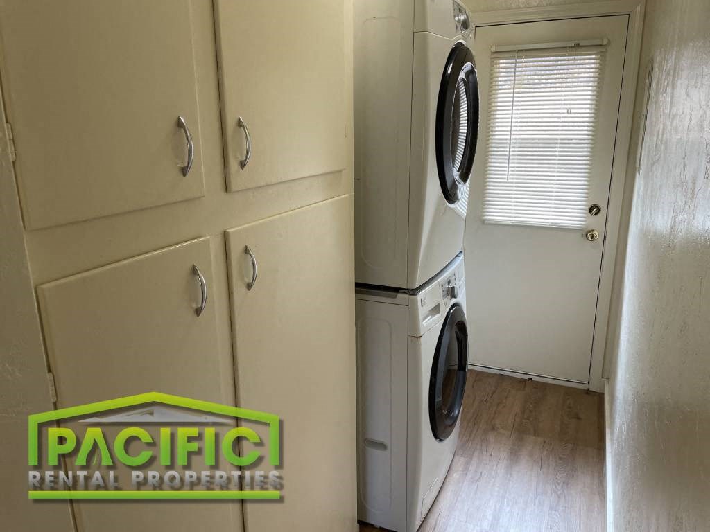 a laundry room with a washer and a dryer in it