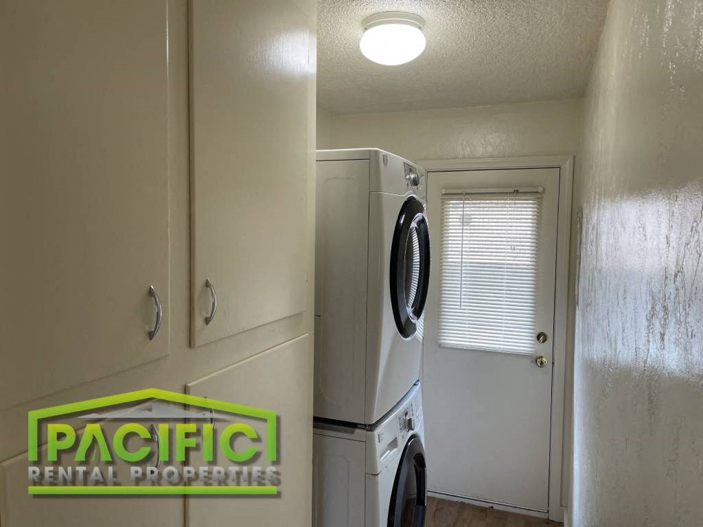a laundry room with a washer and dryer in it