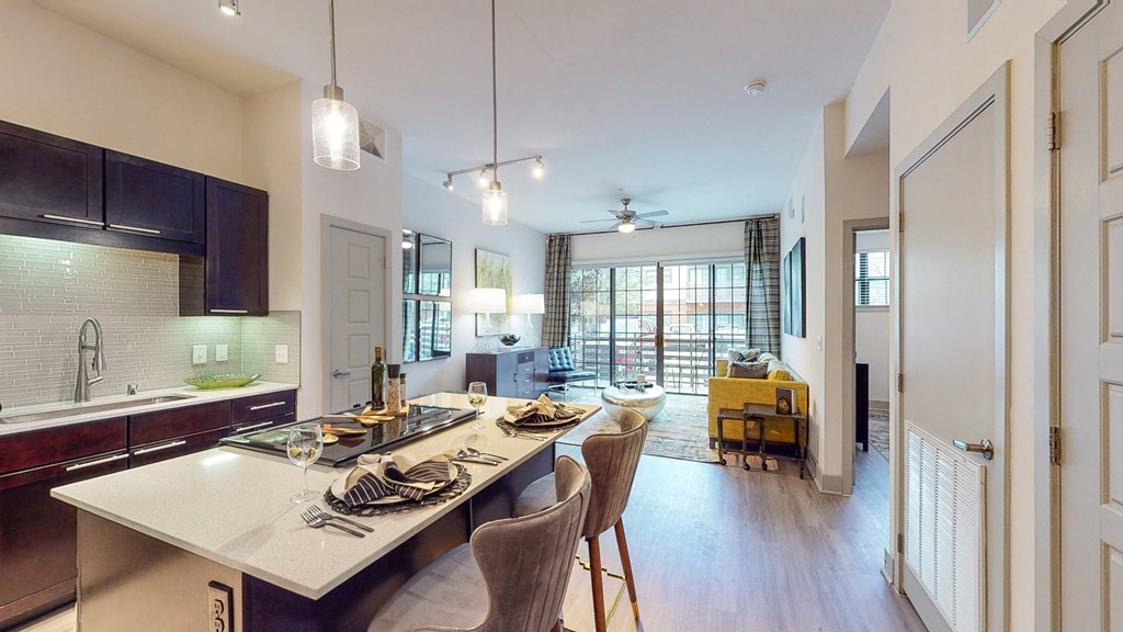 an open kitchen and dining room with a table and chairs