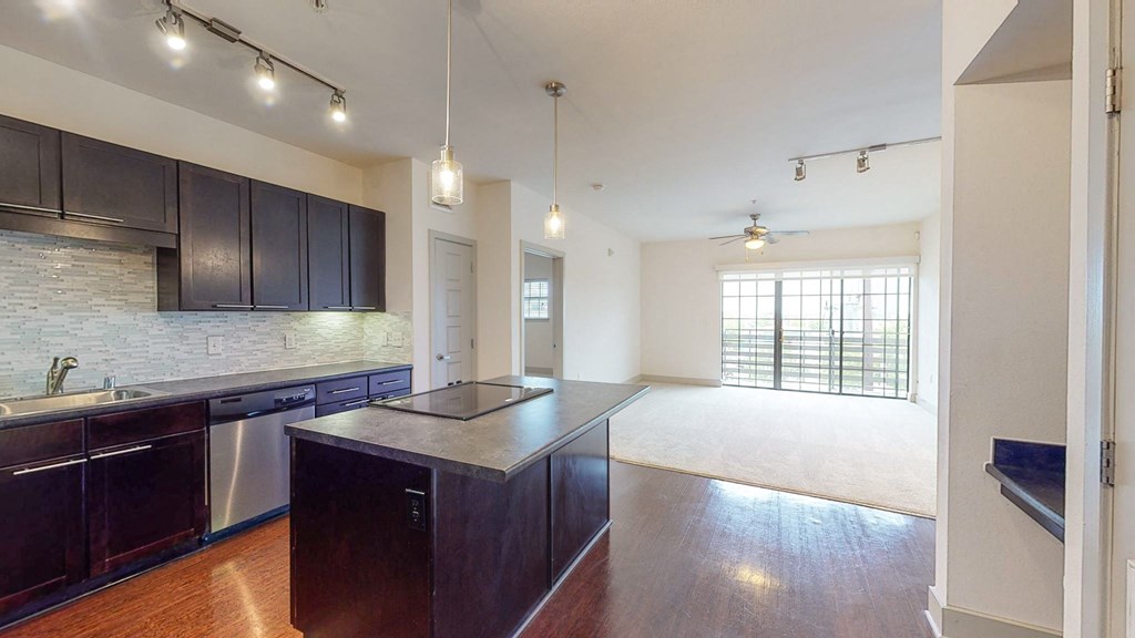 a kitchen with a large island in the middle of it