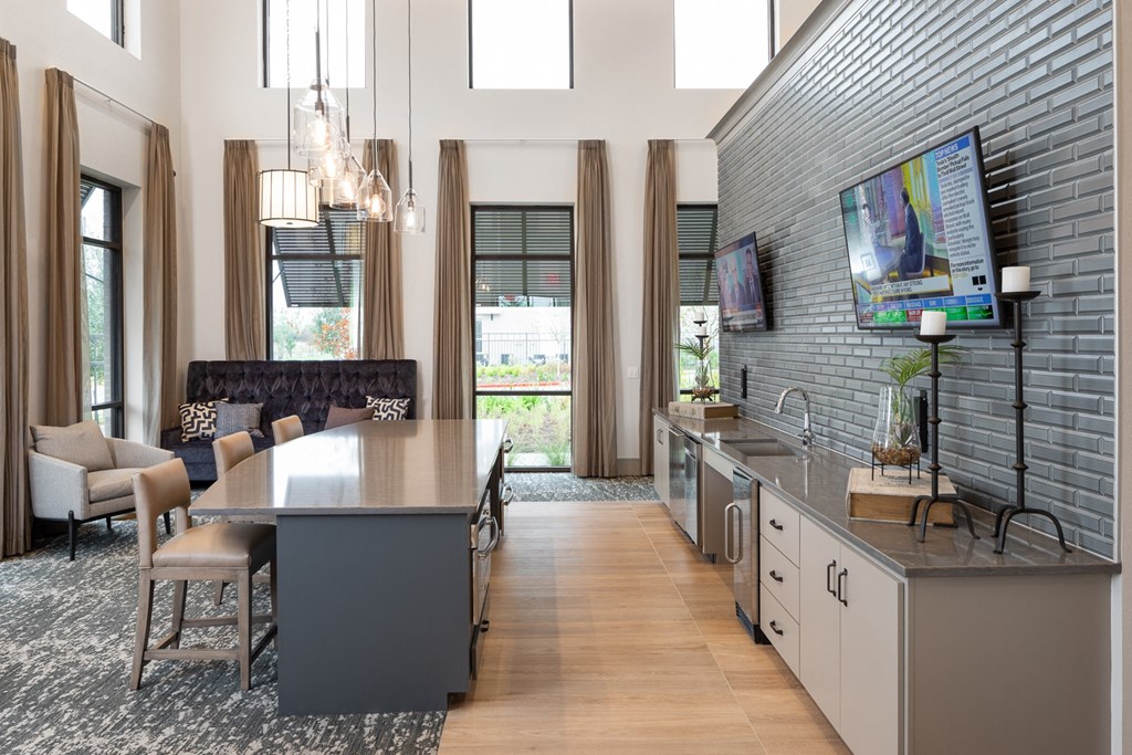 a living room with a kitchen and a dining room