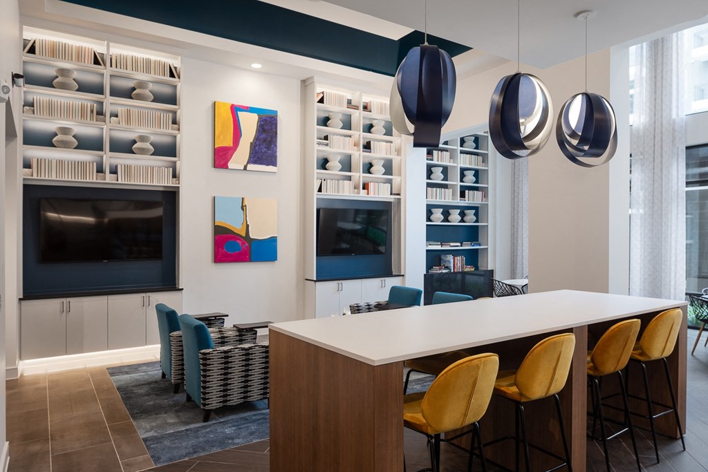 a dining room with a table and chairs and a television