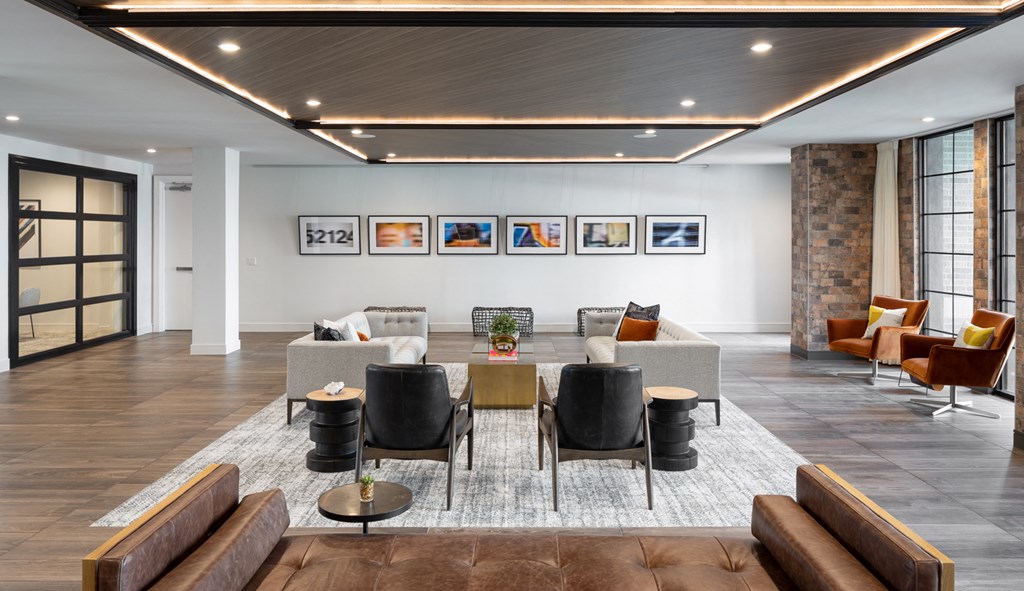 a living room with a couch and a table and chairs