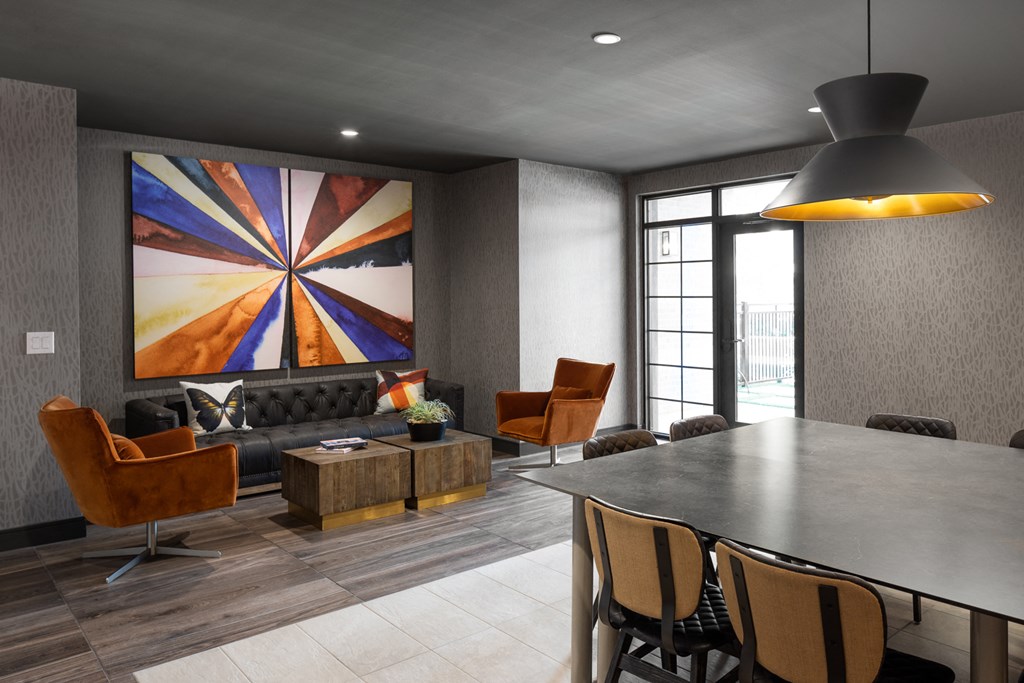 a living room with a table and chairs