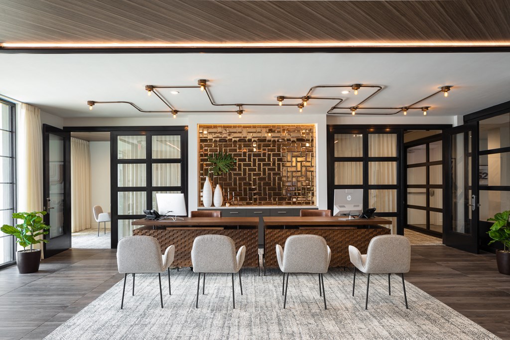 a conference room with a desk and chairs