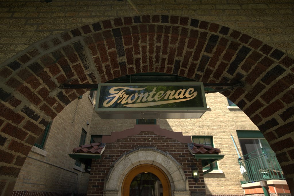 A brick archway with a sign that says Frontenac.
