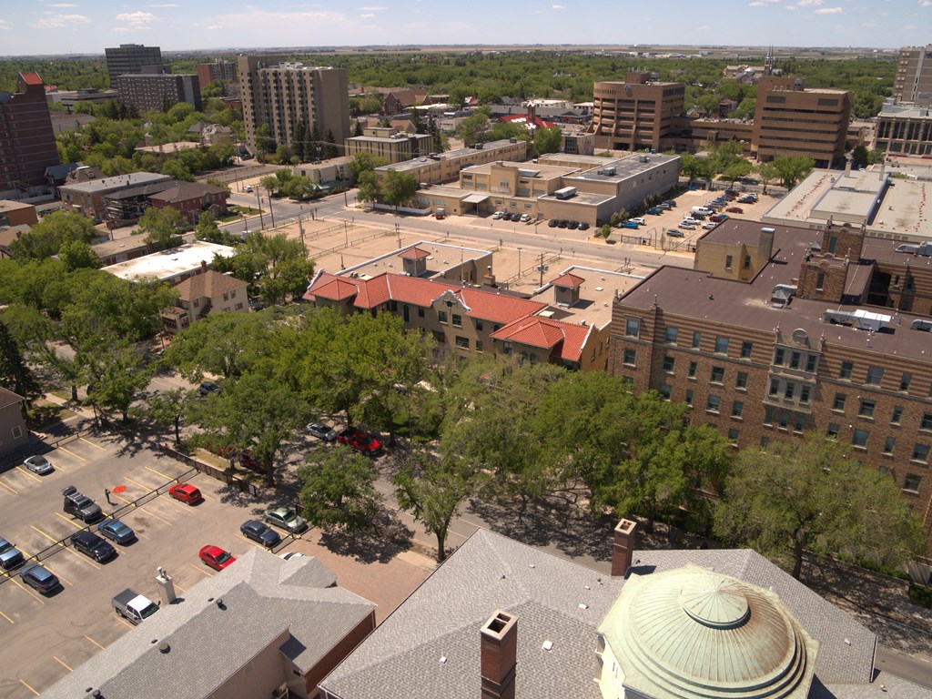 A cityscape with a mix of residential and commercial buildings.