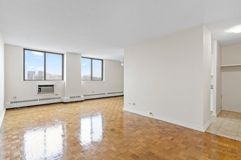 A room with wooden floors and white walls.