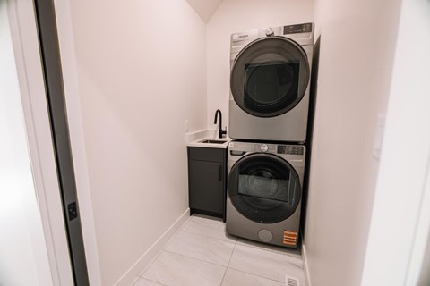 Two ovens are in a small space.