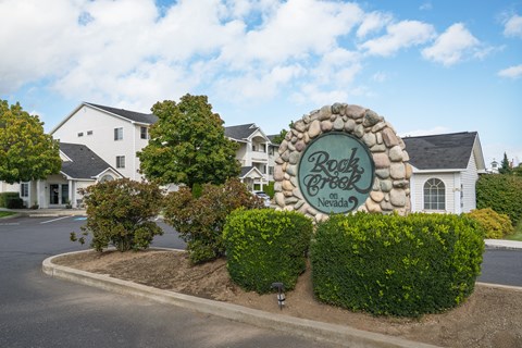 the sign estates with houses in the background
