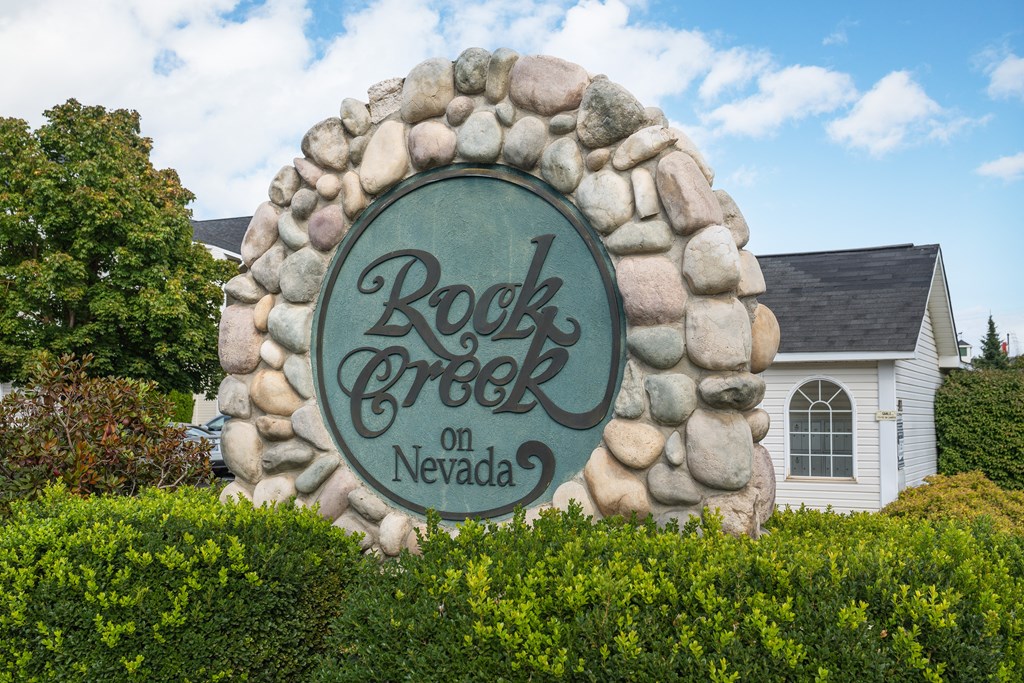 the sign for rockgrove in front of a house