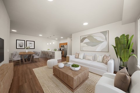 A living room with a white couch, a coffee table, and a dining table with chairs.
