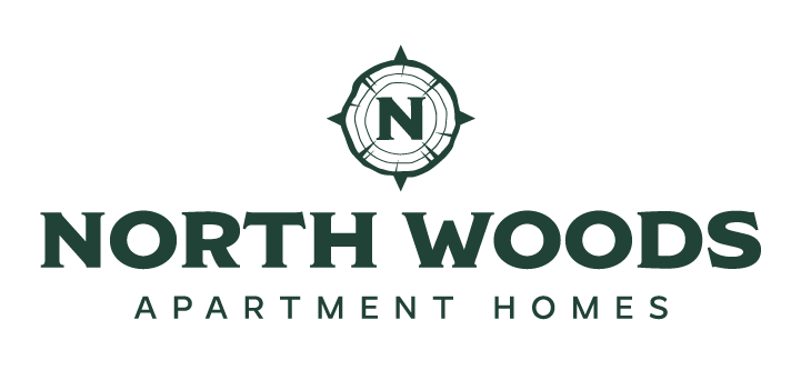The image is a logo for North Woods Apartment Homes.