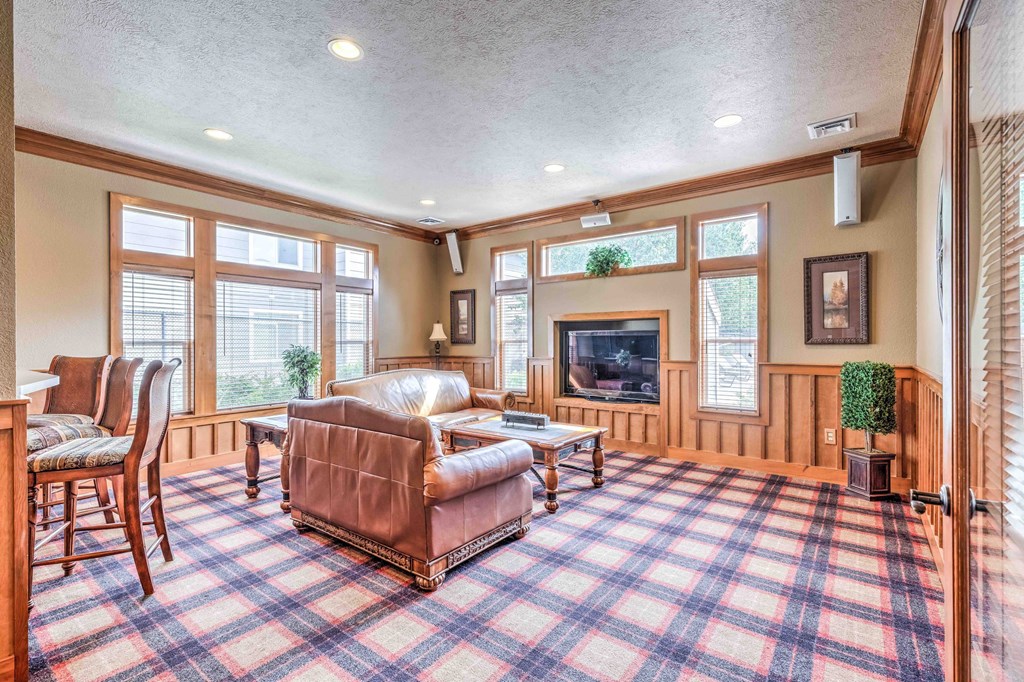 a living room with a couch and a fireplace