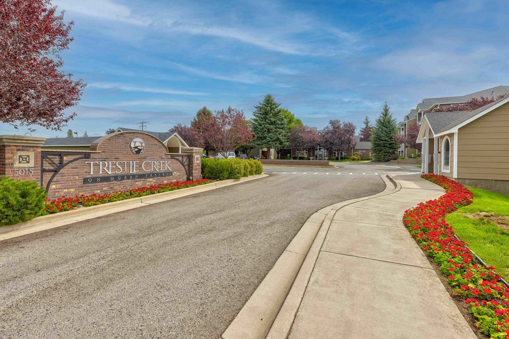 a street with a sign that reads tristen city in front of a house