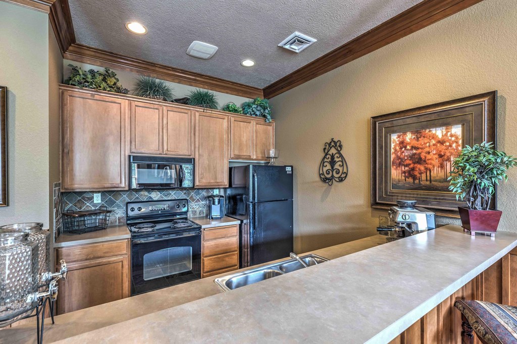 a kitchen with a counter top and a sink