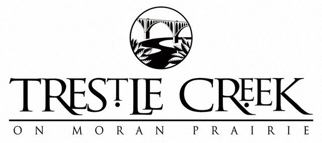 a logo for the treetop creek