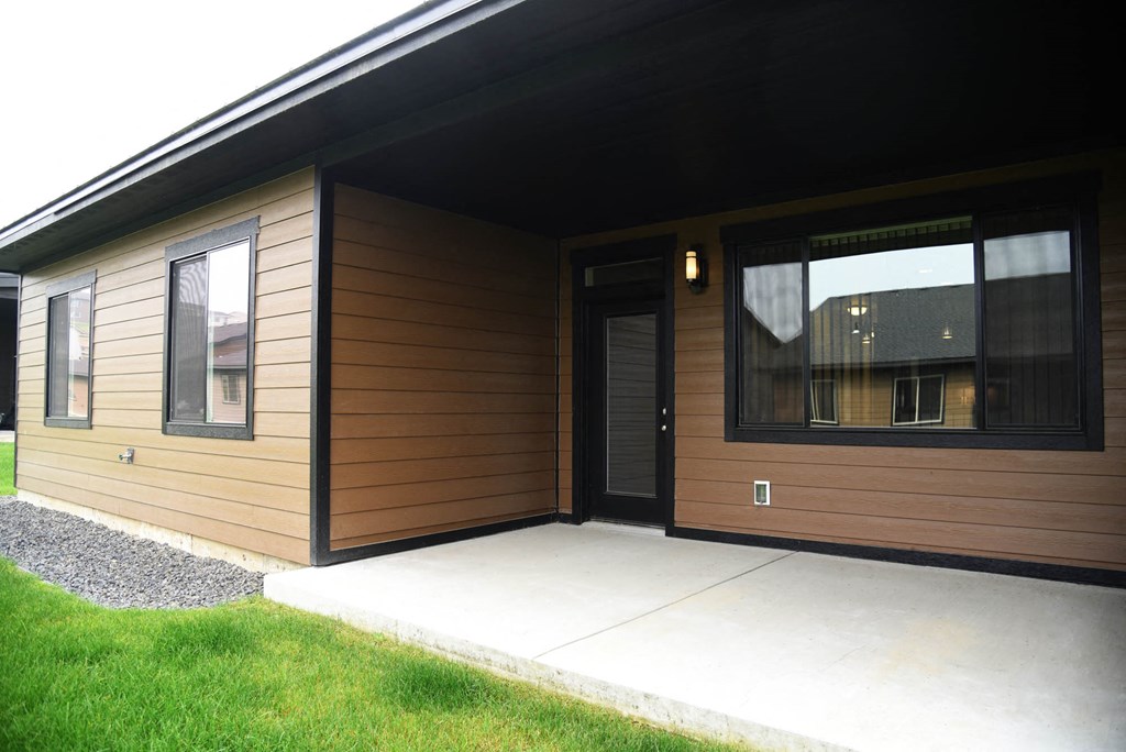 the front of the house with a ramp to the door