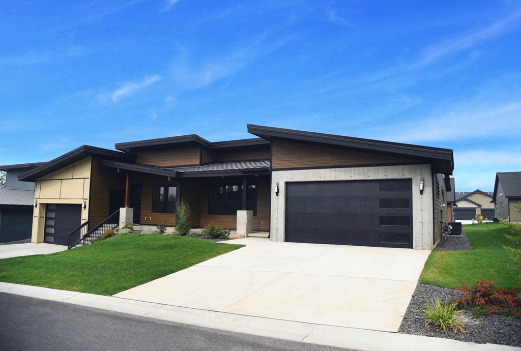 a house with a driveway and a garage door