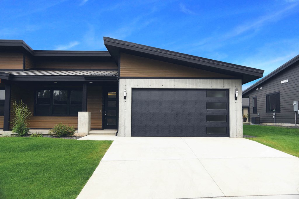 a house with a driveway and a garage door