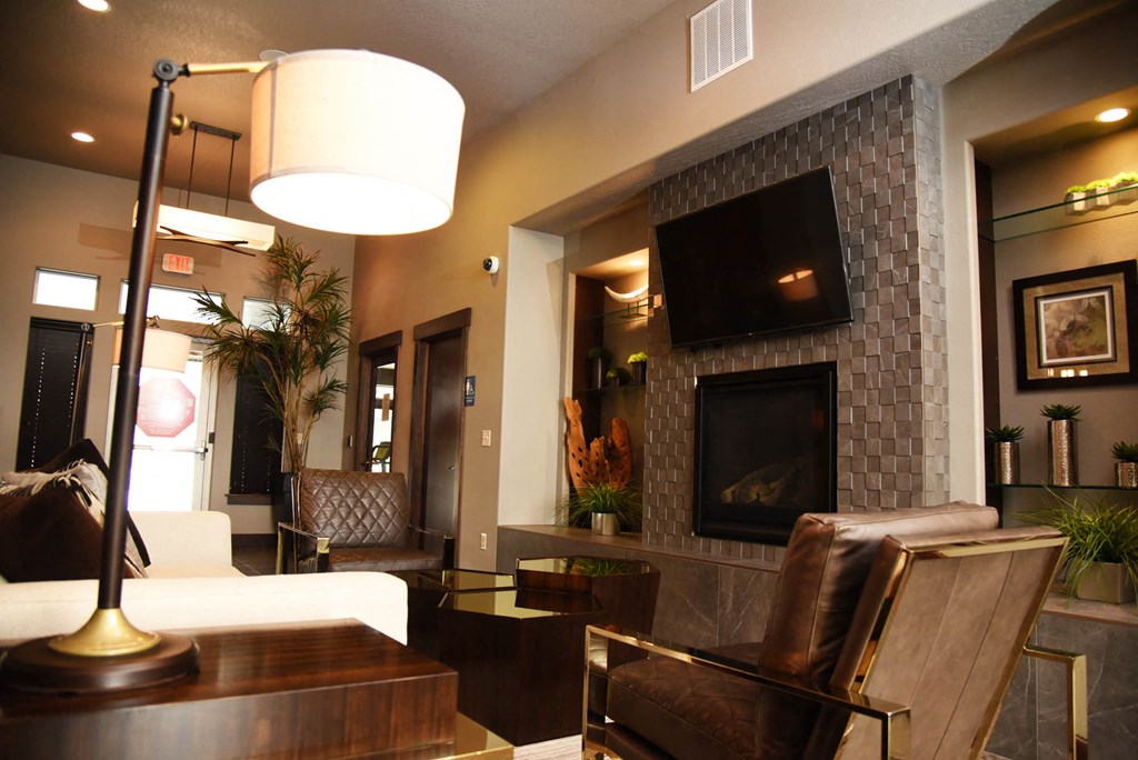 a living room with a fireplace and a tv