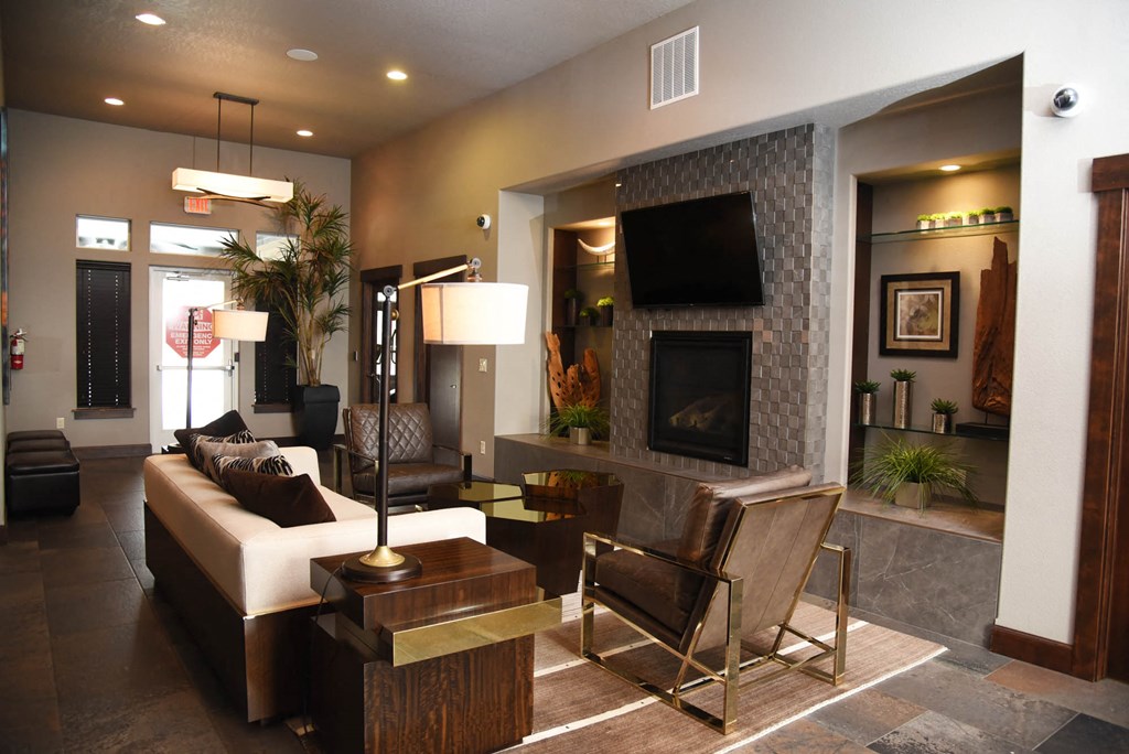 a living room with a couch and a table and a fireplace