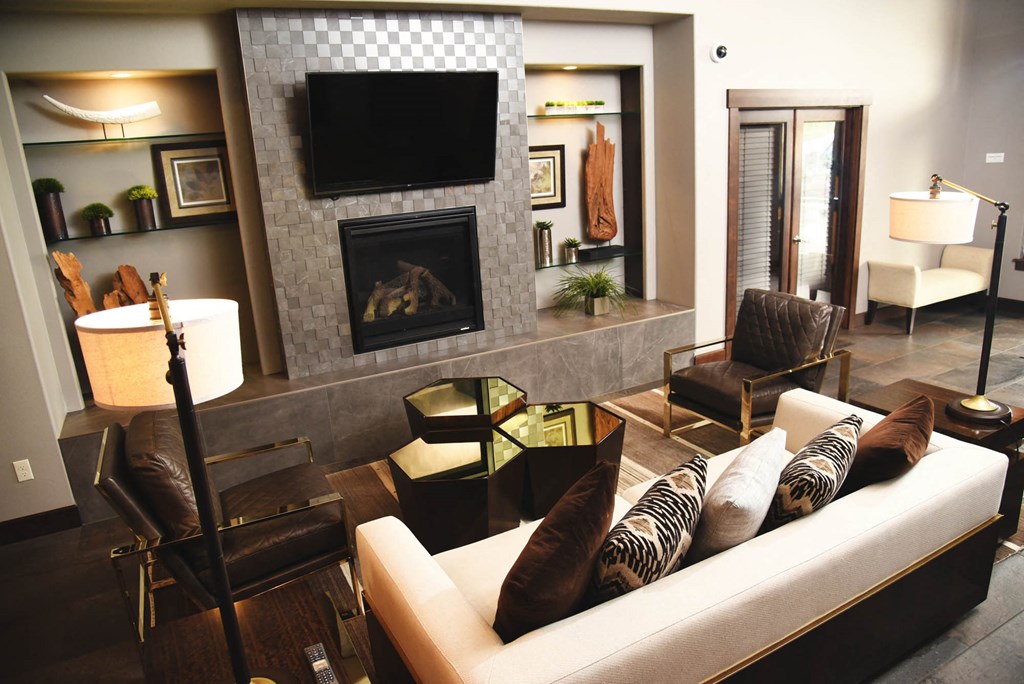 a living room with a couch and a fireplace