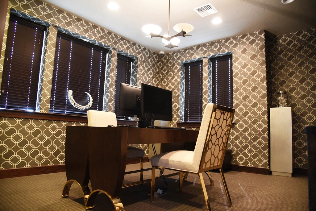 a home office with a desk and a computer