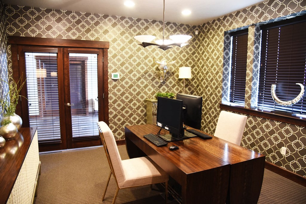 a home office with a desk and a computer