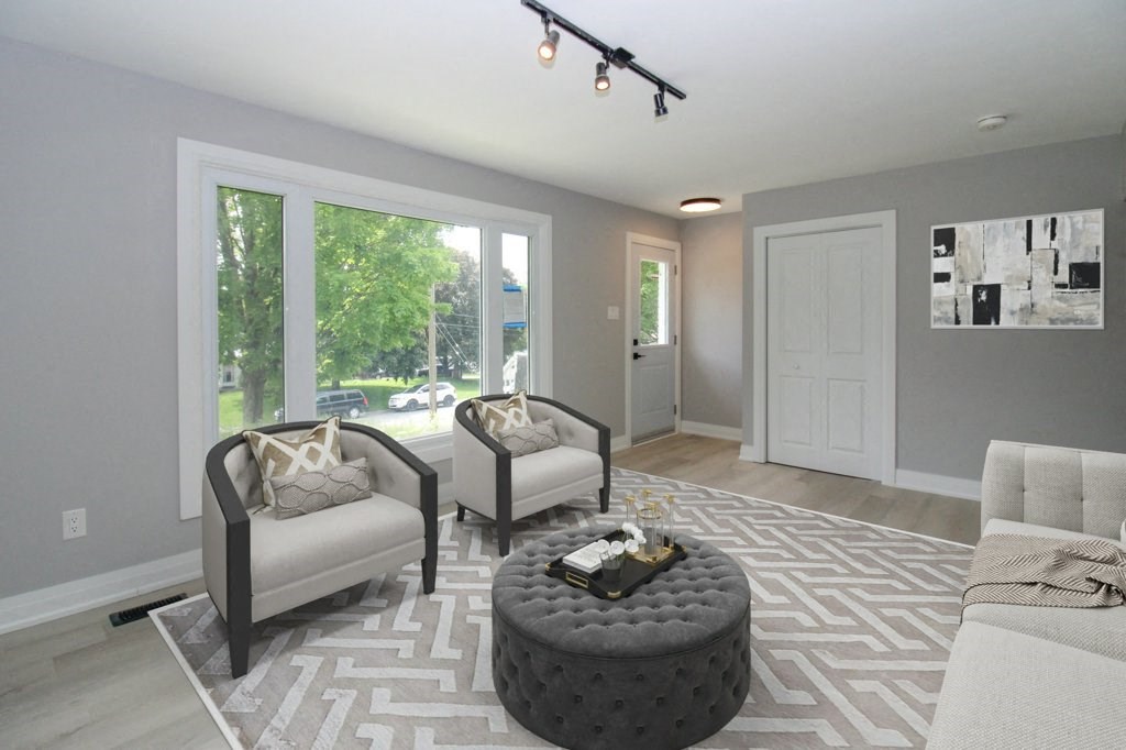 a living room with two chairs and a