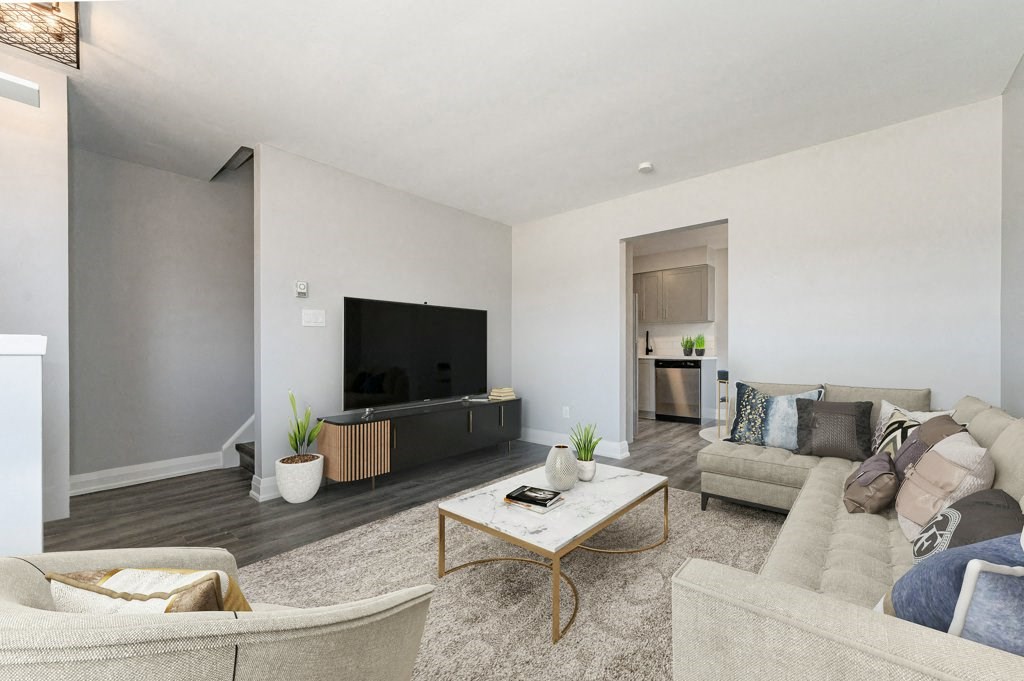 a living room with a couch and a tv