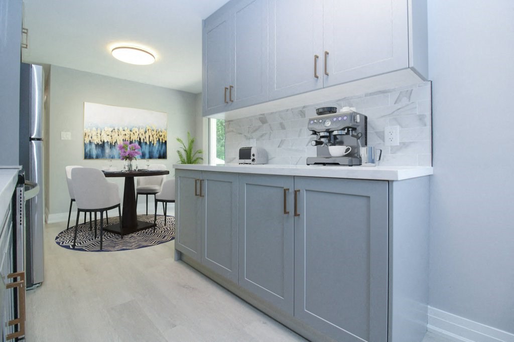 a kitchen with blue cabinets and a coffee machine on the counter