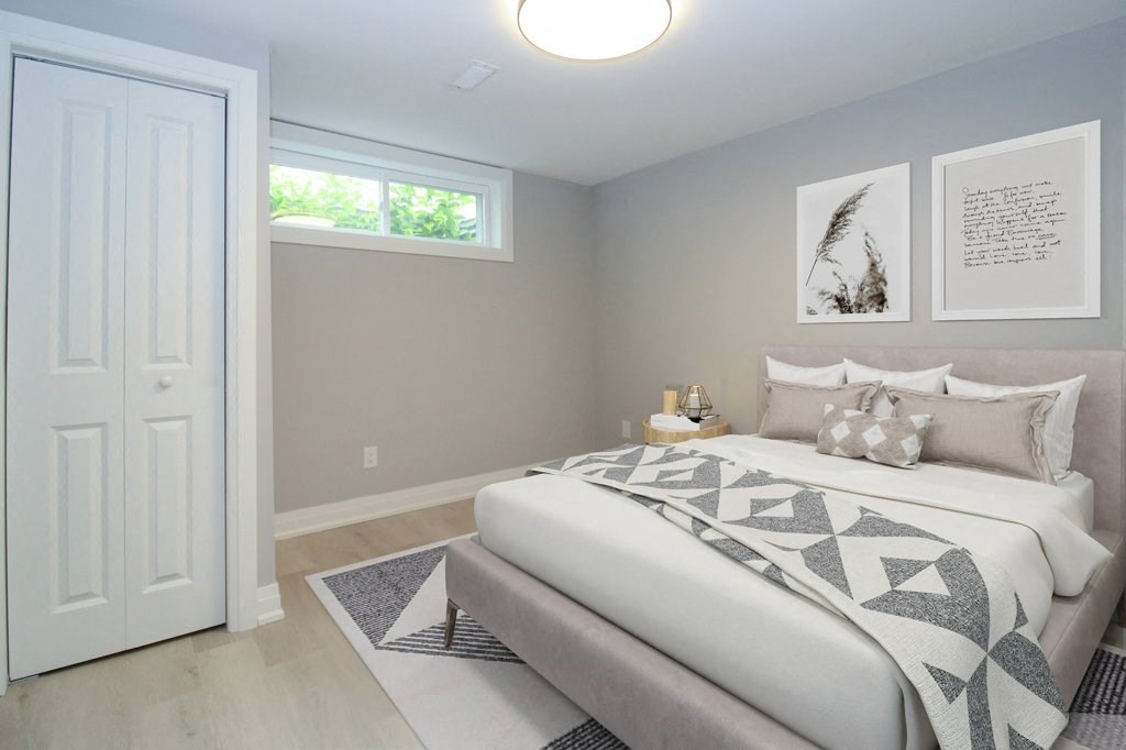 a bedroom with a large bed and a window