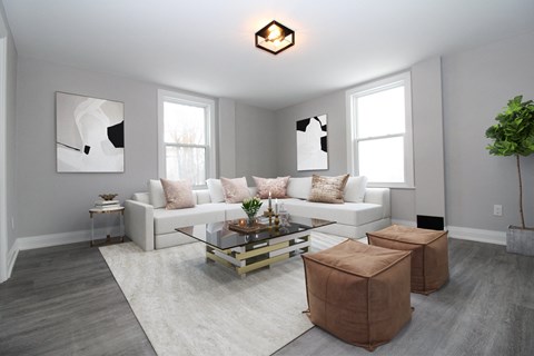 a living room with a white couch and a coffee table