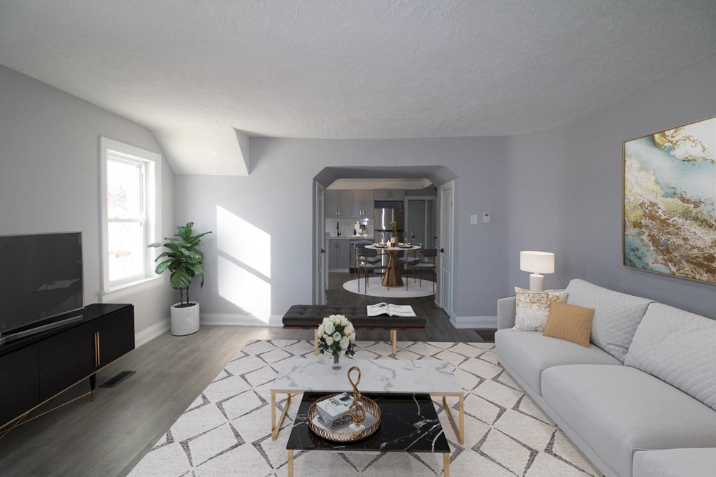 a living room with a white couch and a coffee table
