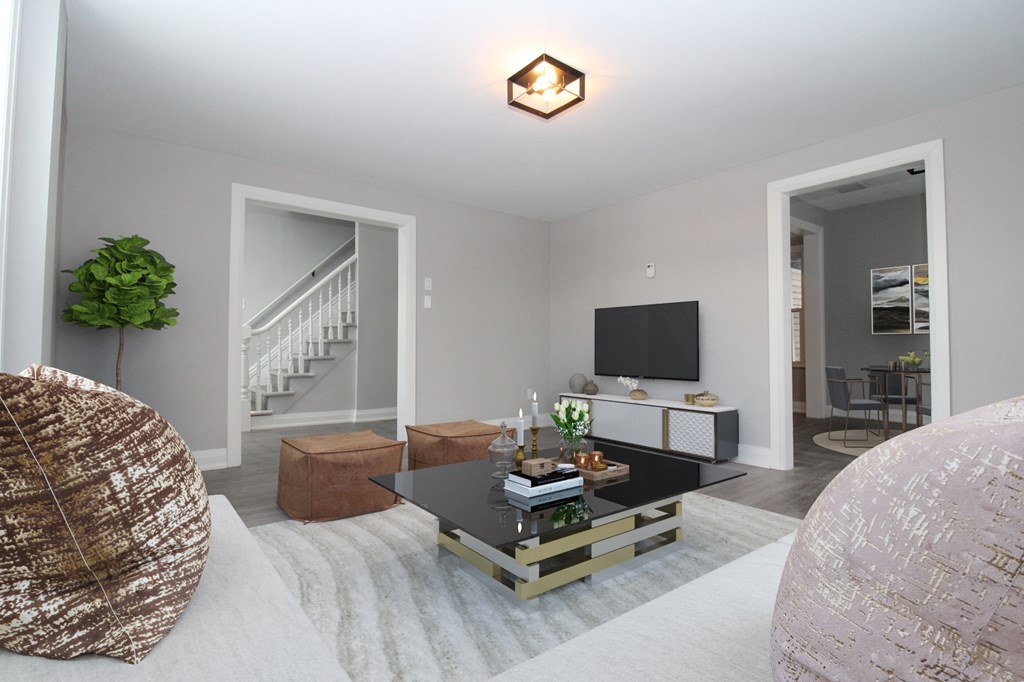 a living room with a white couch and a coffee table