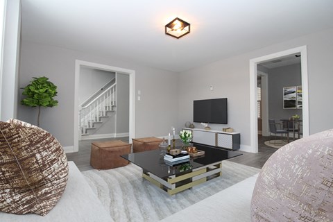 a living room with a white couch and a coffee table