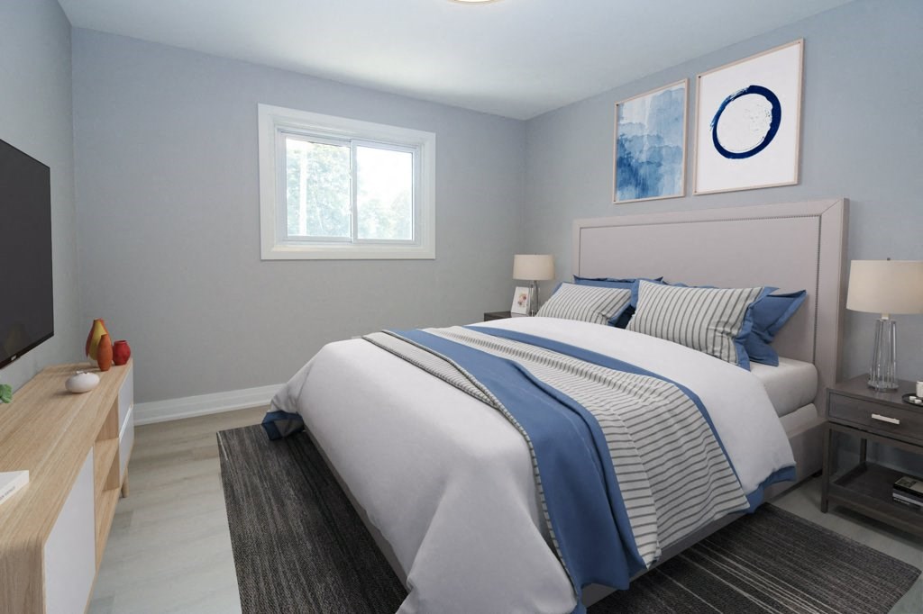 a bedroom with a bed and a tv