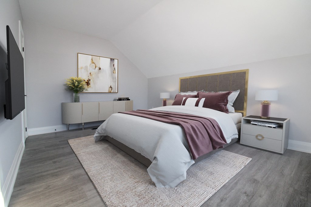 a bedroom with a bed and a rug