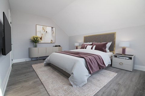 a bedroom with a bed and a rug