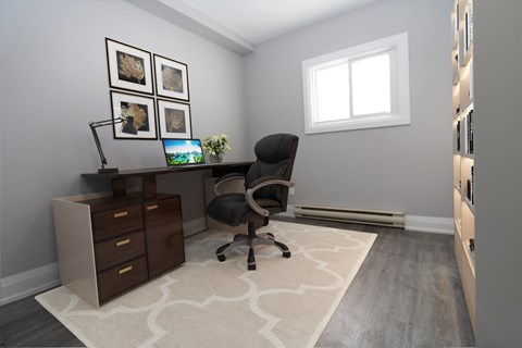a home office with a desk and a chair
