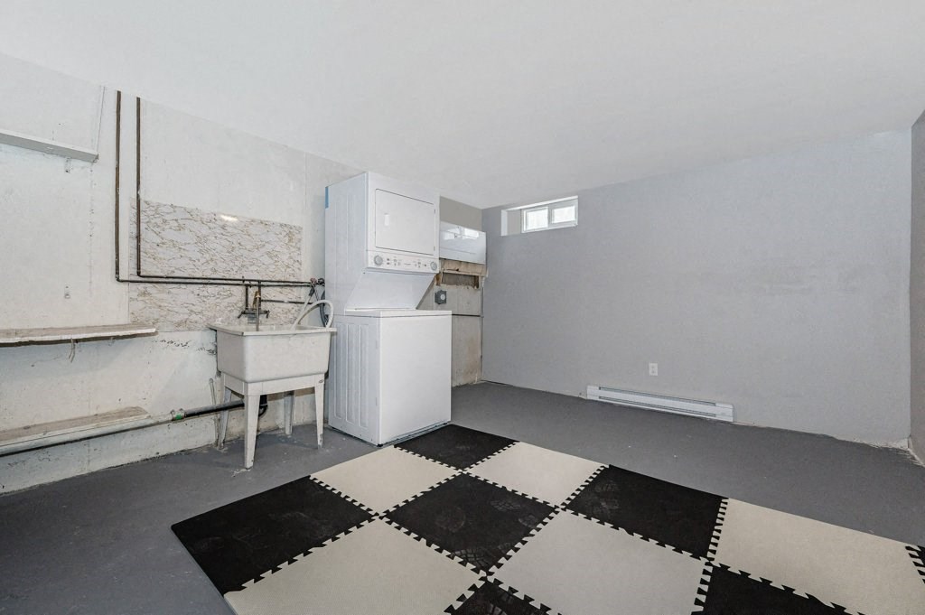 a renovated kitchen with a black and white checkered floor