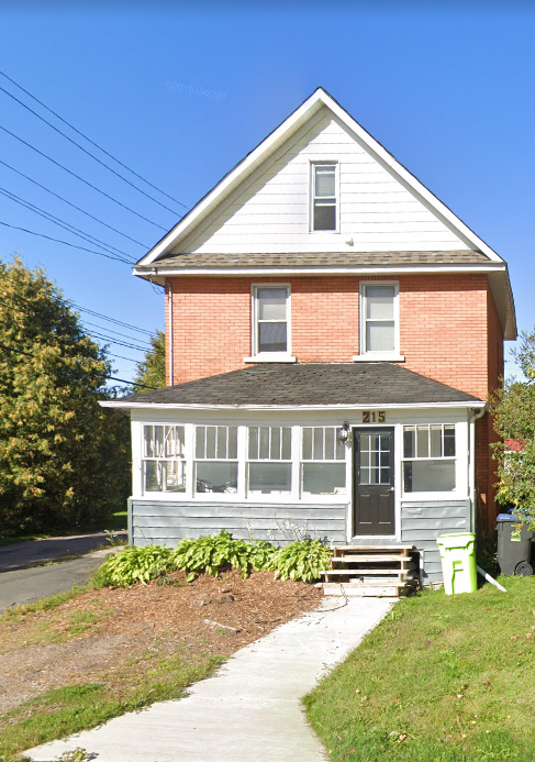 a house with a sidewalk in front of it
