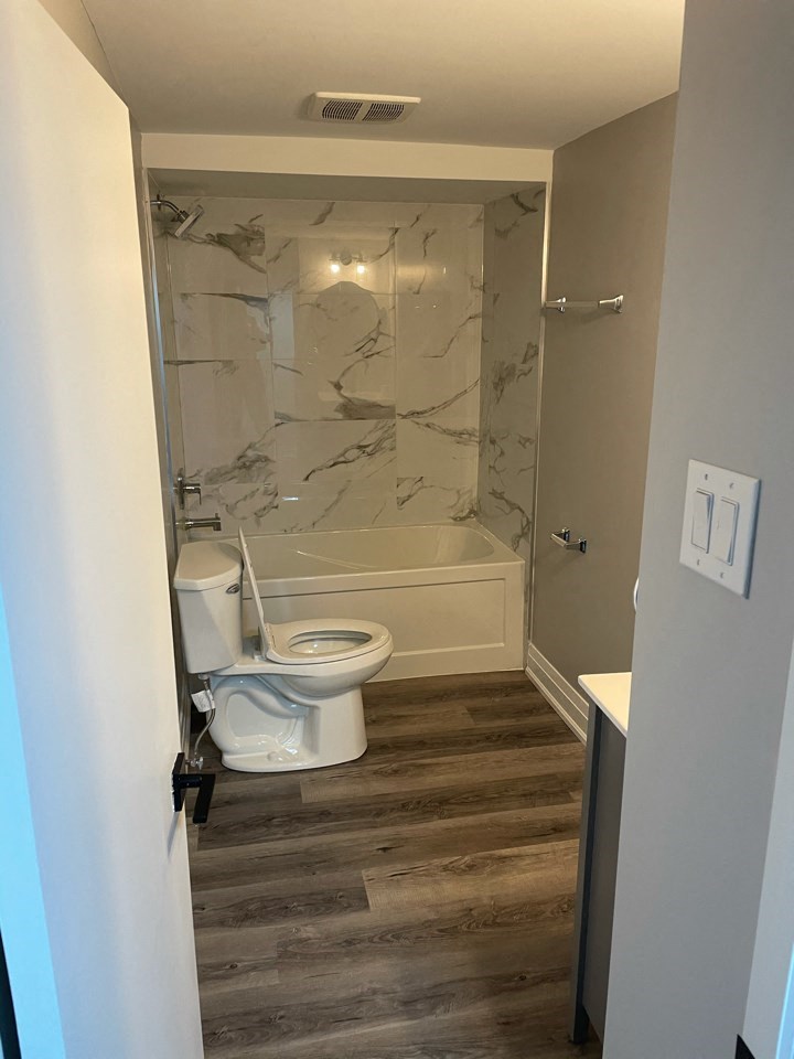 a small bathroom with a toilet and a shower