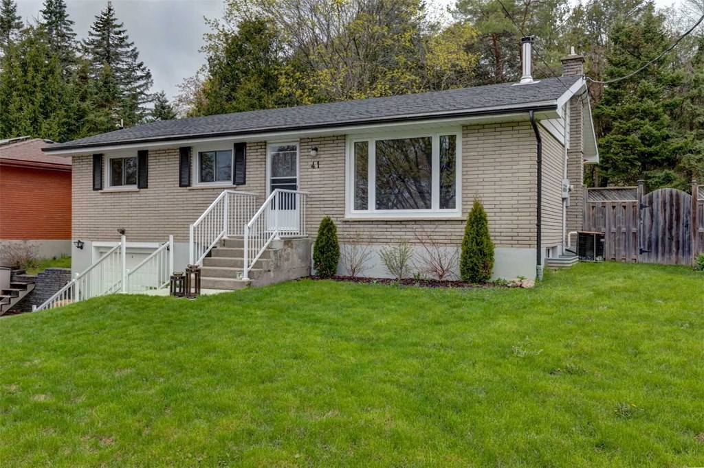 a small house with a lawn in front of it